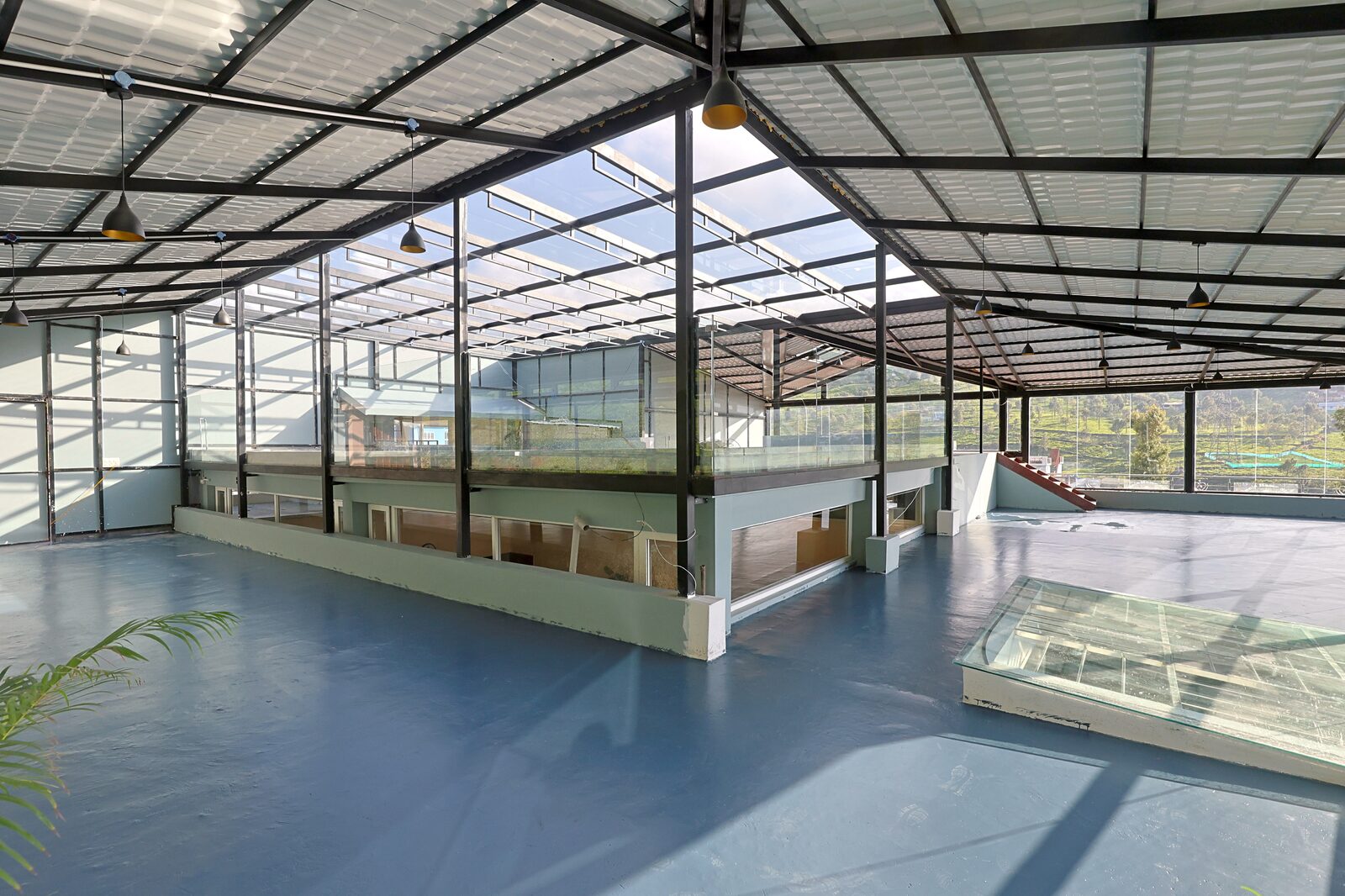 Open floor of the banquet hall with a glazed balustrade around the central atrium void