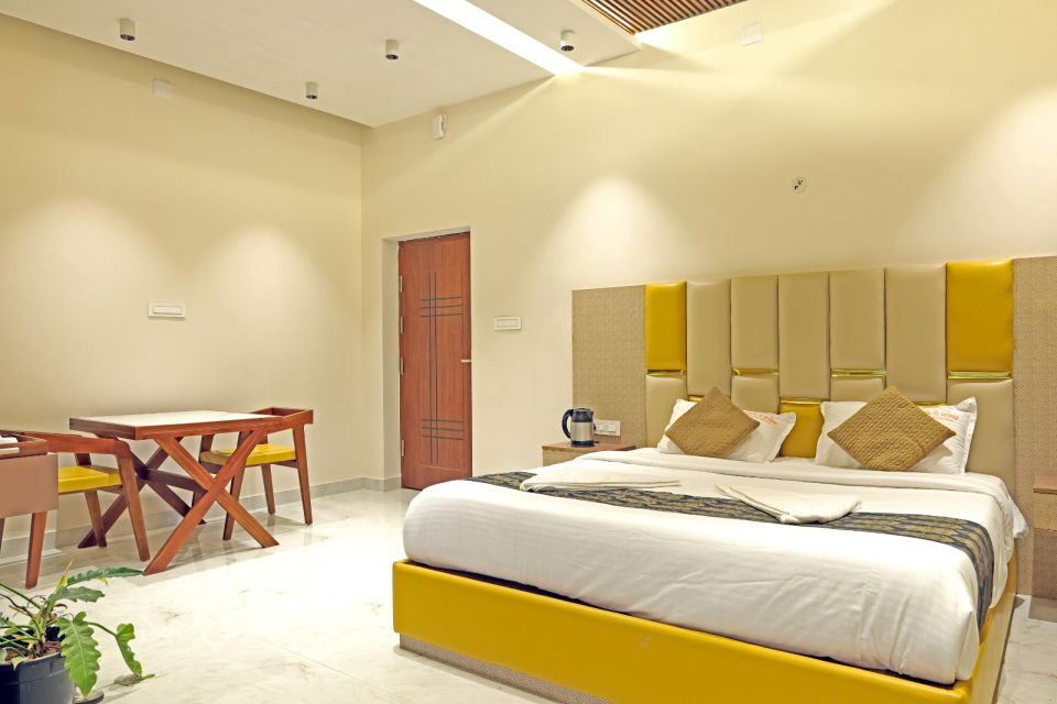 Executive Suite with king-size bed and gold upholstered headboard