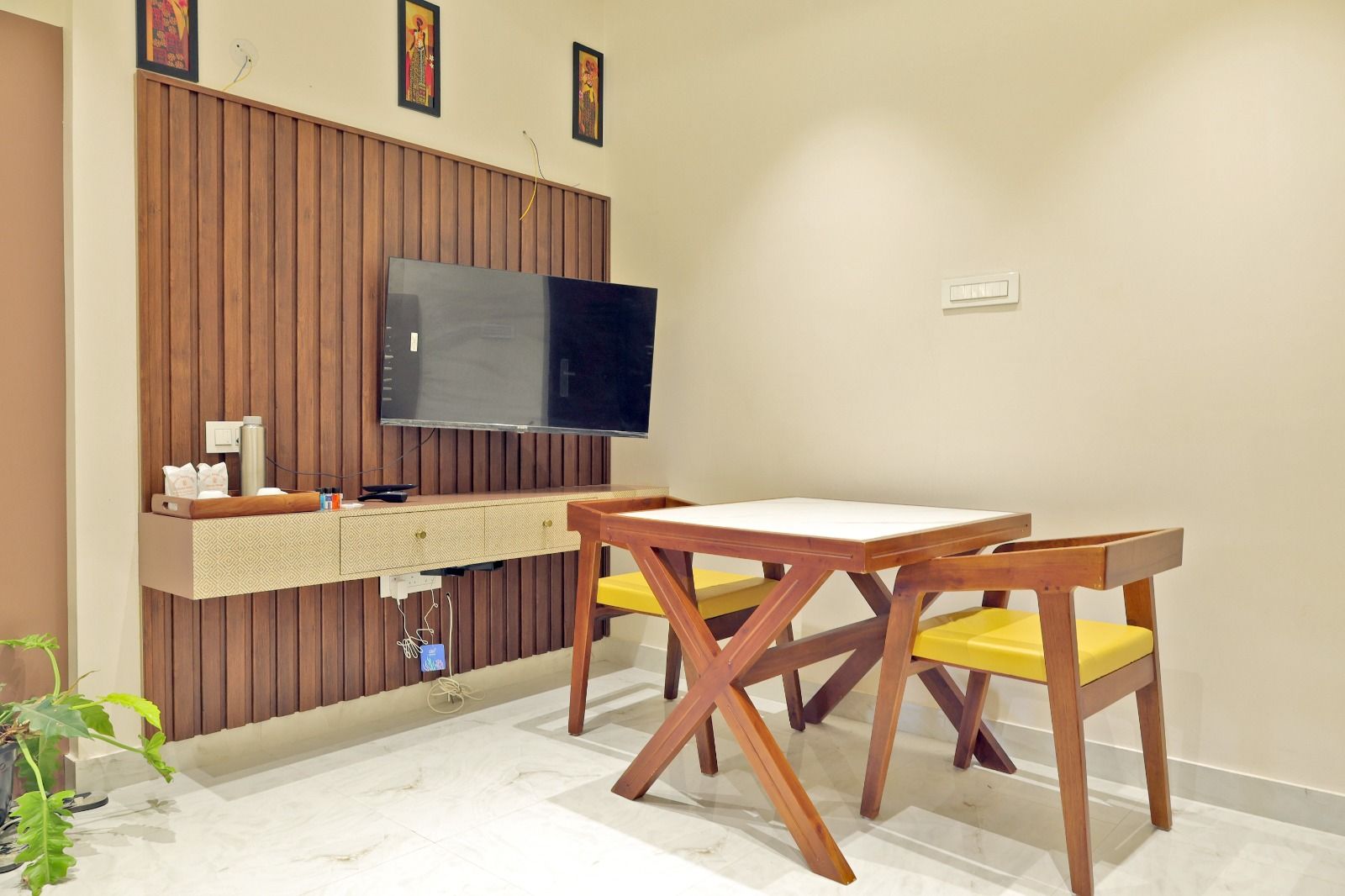 Executive Hill View Suite at Sinnis Home Stay with a wooden slat feature wall, lounge seating and dining table